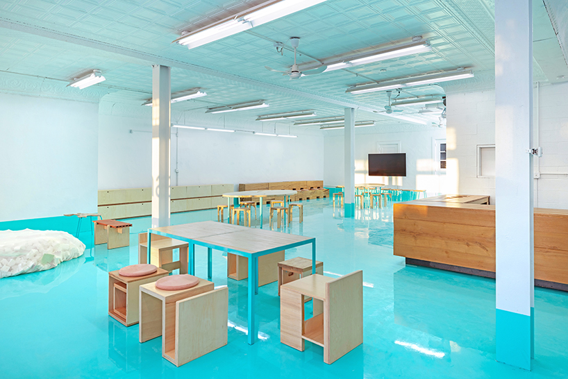 reclaimed oak, cork, and cardboard build flexible furniture for cultural hub in NY - 2