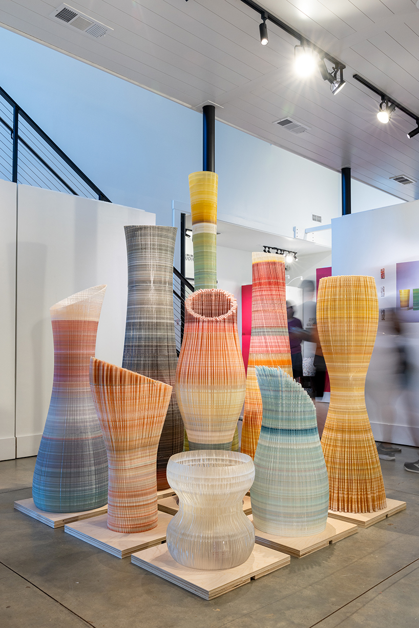 ninefold transforms discarded plastic into an immersive field of sound light and architecture 10