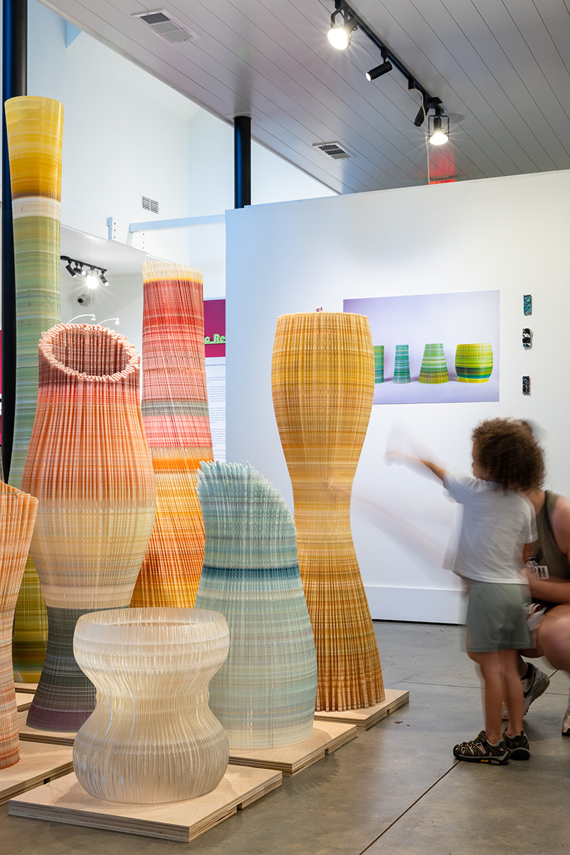 ninefold transforms discarded plastic into an immersive field of sound light and architecture 11