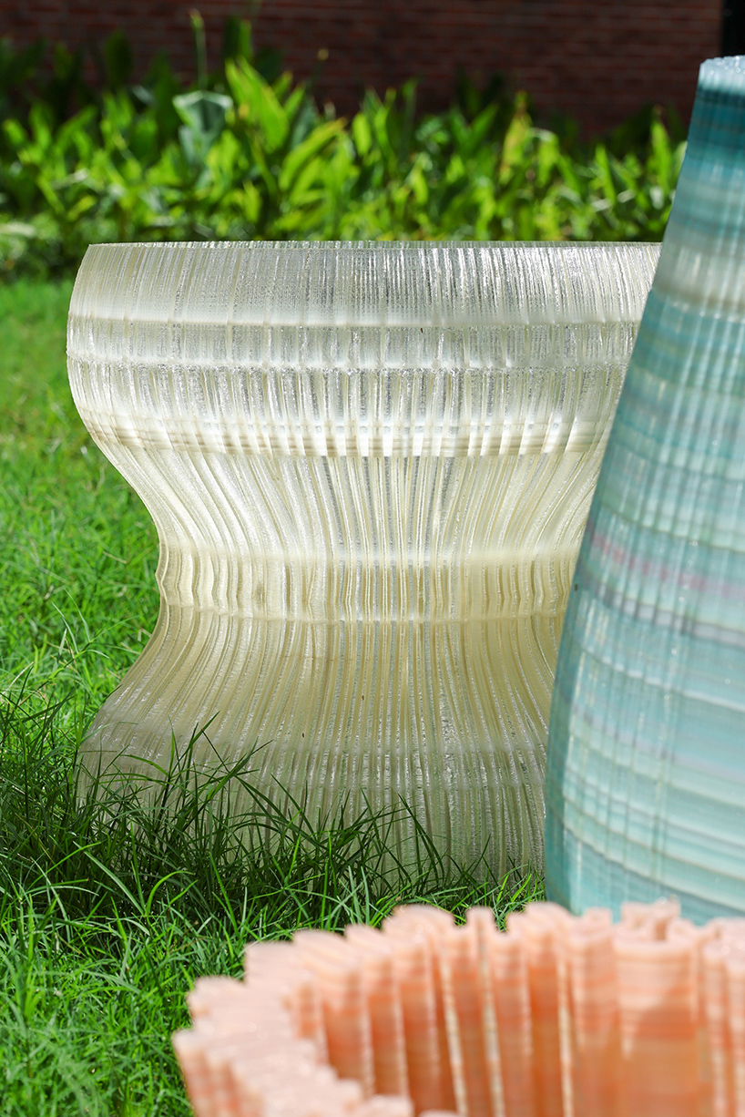 ninefold transforms discarded plastic into an immersive field of sound light and architecture 9
