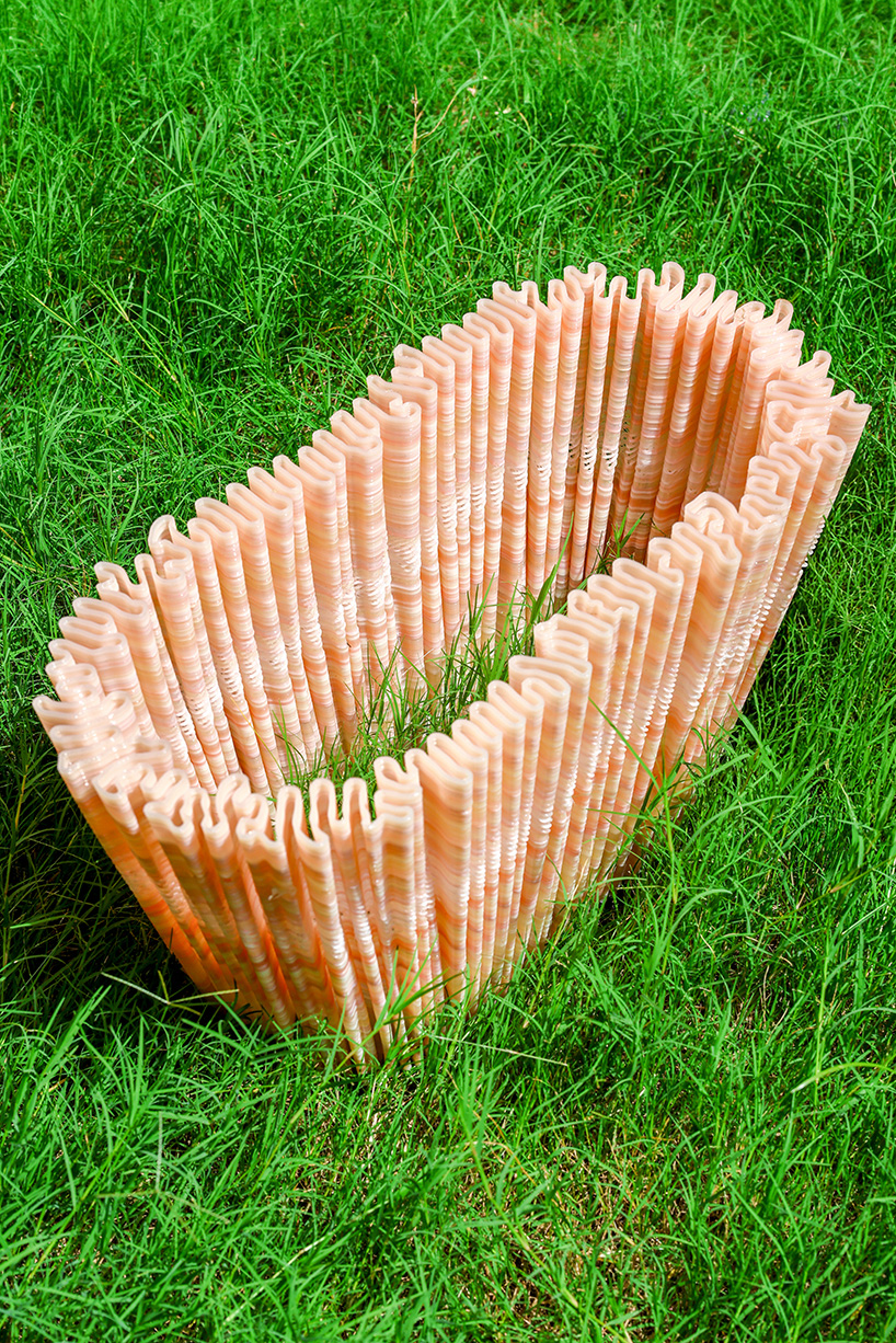 ninefold transforms discarded plastic into an immersive field of sound light and architecture 7