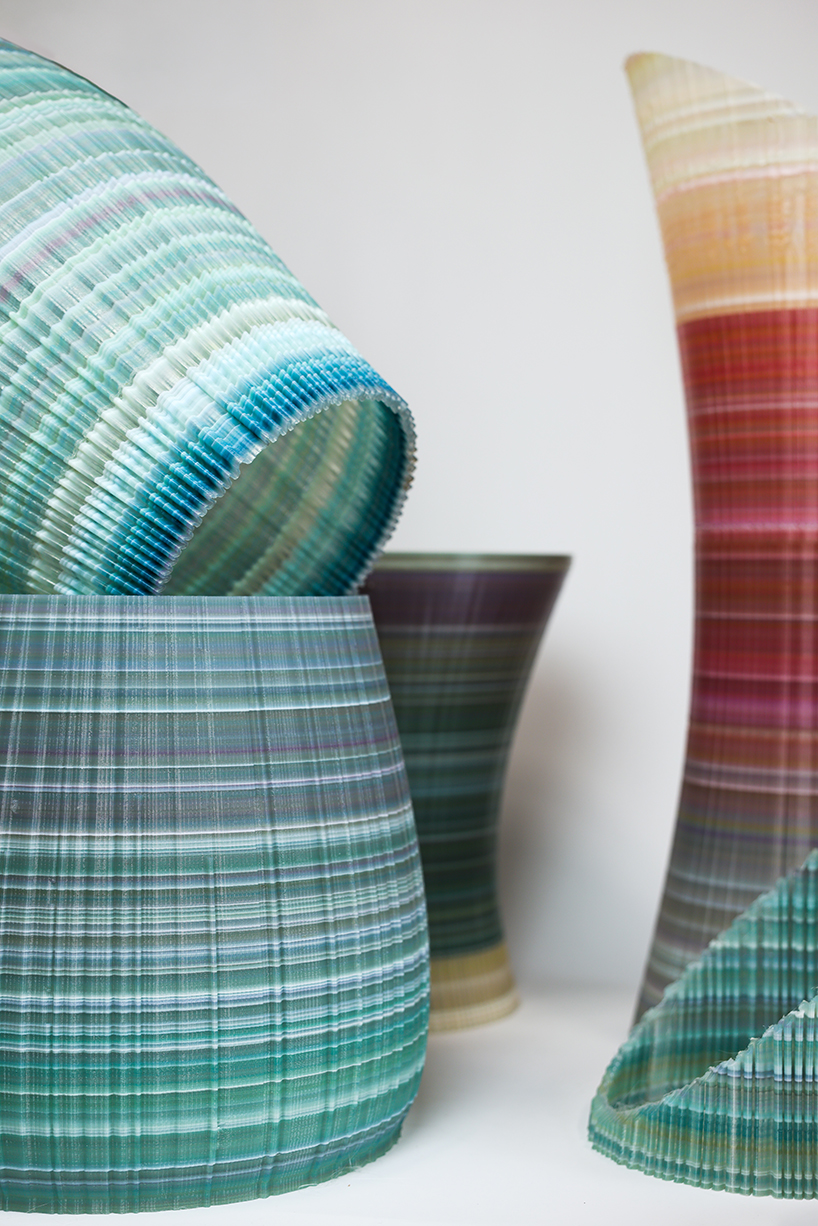 ninefold transforms discarded plastic into an immersive field of sound light and architecture 5