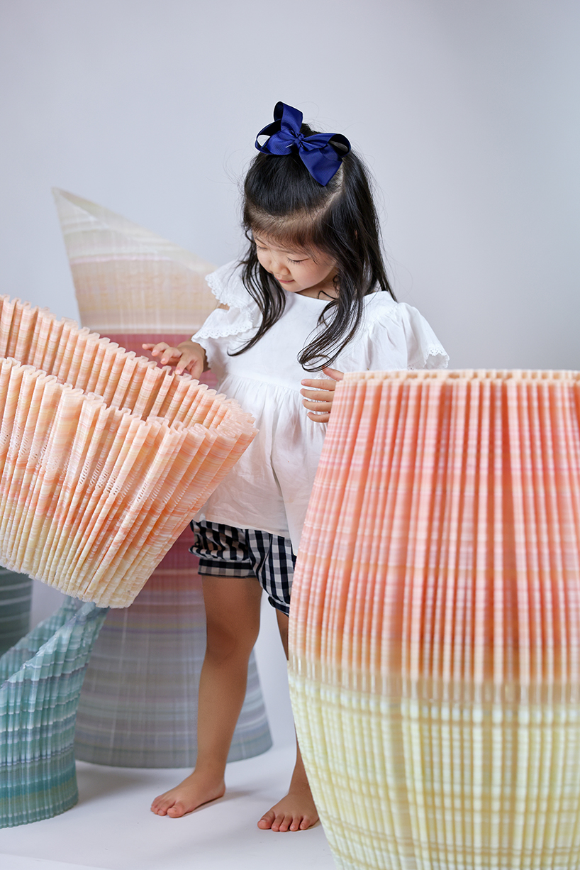 ninefold transforms discarded plastic into an immersive field of sound light and architecture 6